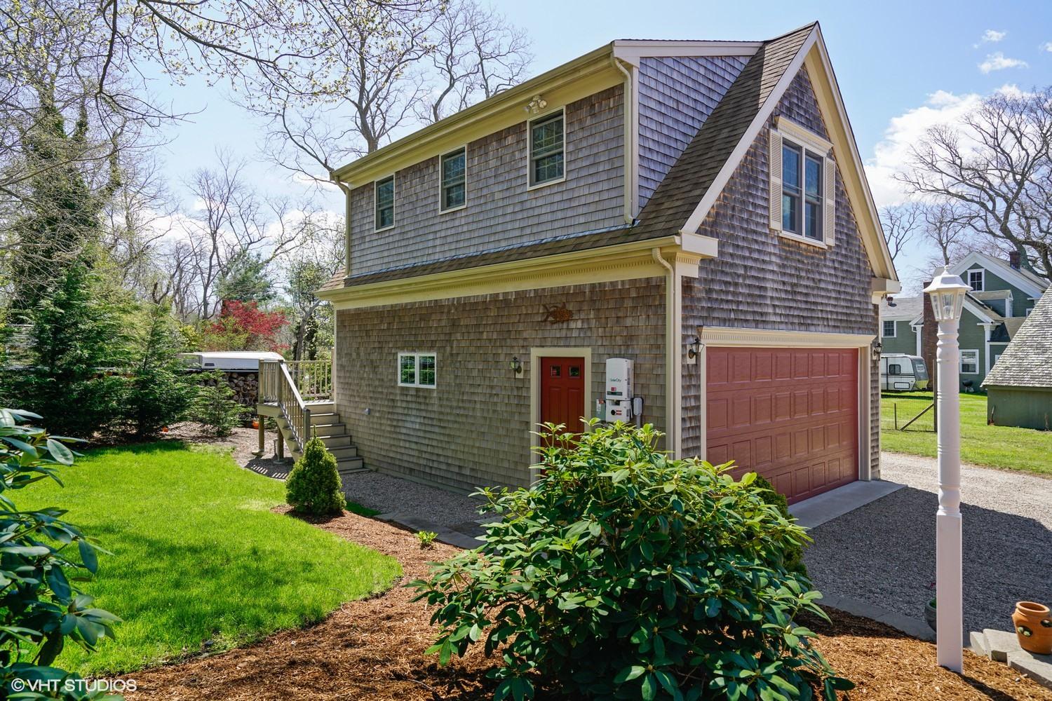 230 Locust Road Eastham, MA 02642 - Photo 6 of 17 a front view of a house with garden