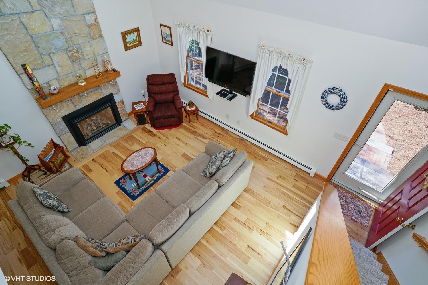 230 Locust Road Eastham, MA 02642 - Photo 8 of 17 a living room with furniture and a flat screen tv