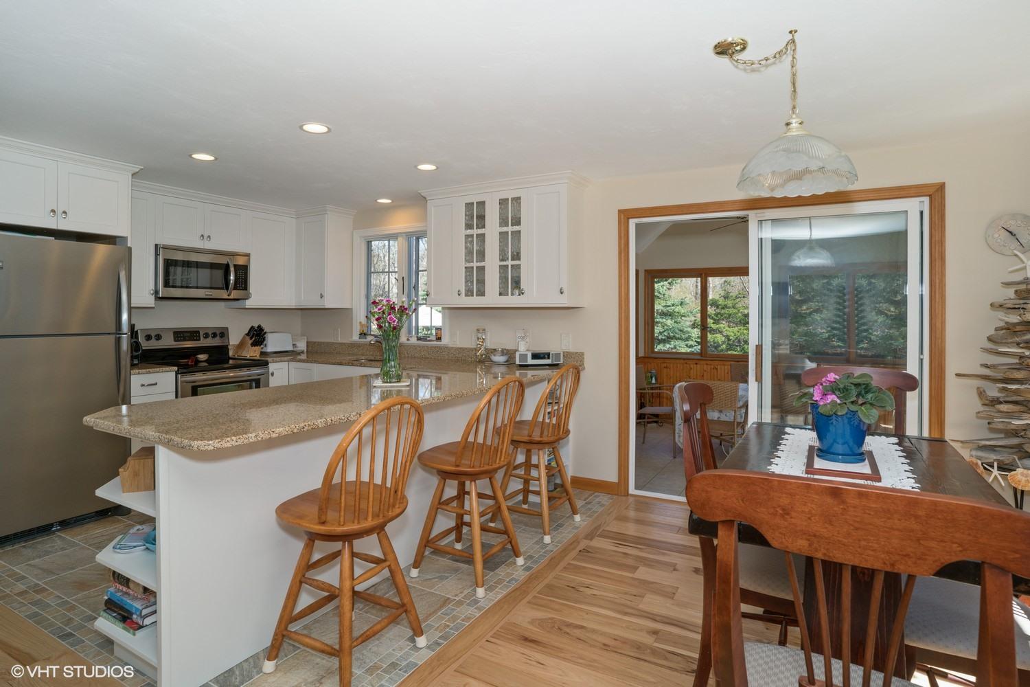 230 Locust Road Eastham, MA 02642 - Photo 10 of 17 a view of a dining room with furniture window and outside view