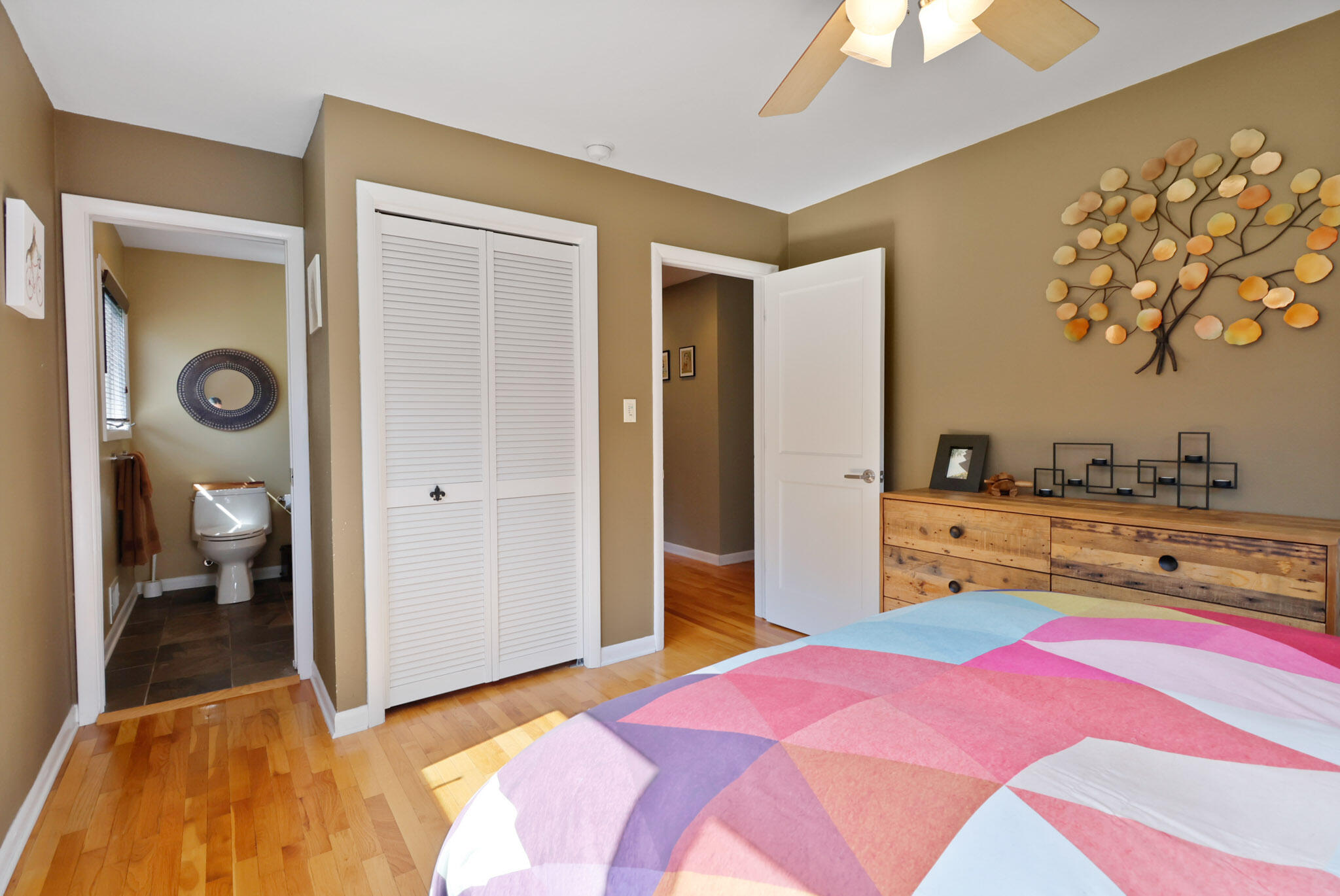 66 Ski Hill Road Portage, IN 46368 - Photo 15 of 48 a bedroom with a bed and a chandelier