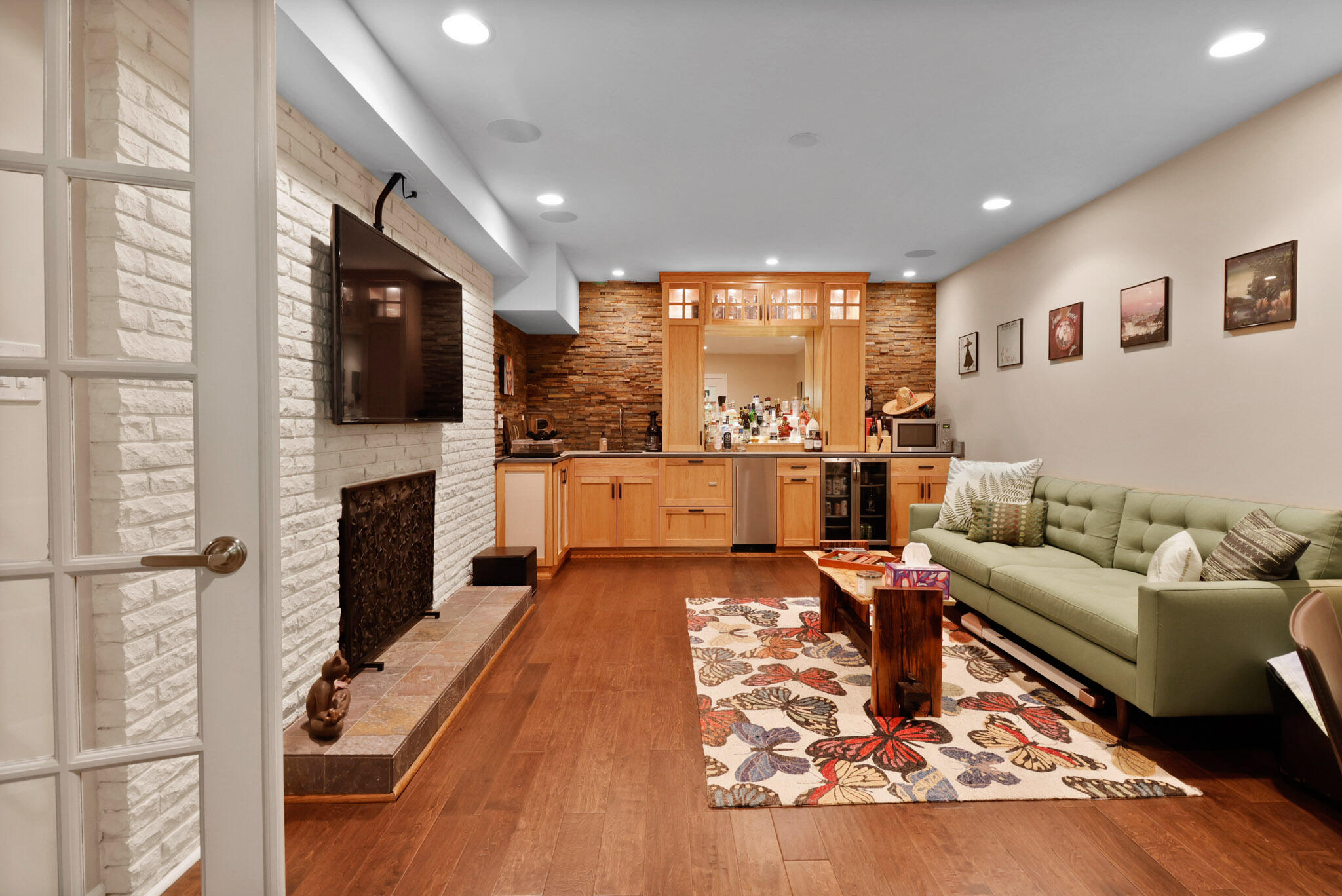 66 Ski Hill Road Portage, IN 46368 - Photo 22 of 48 a living room with fireplace furniture and a flat screen tv