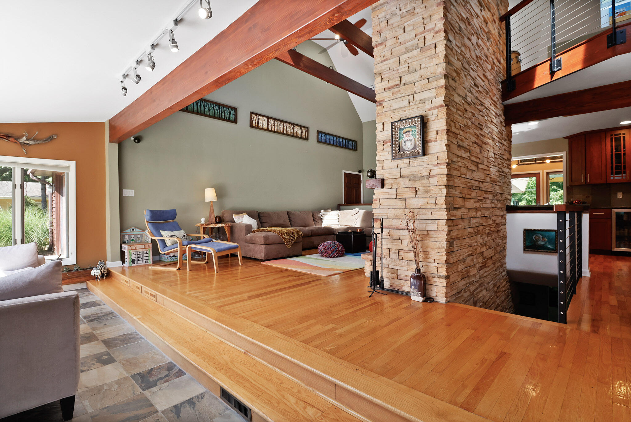 66 Ski Hill Road Portage, IN 46368 - Photo 4 of 48 a view of a patio with table and chairs floor to ceiling window and wooden floor