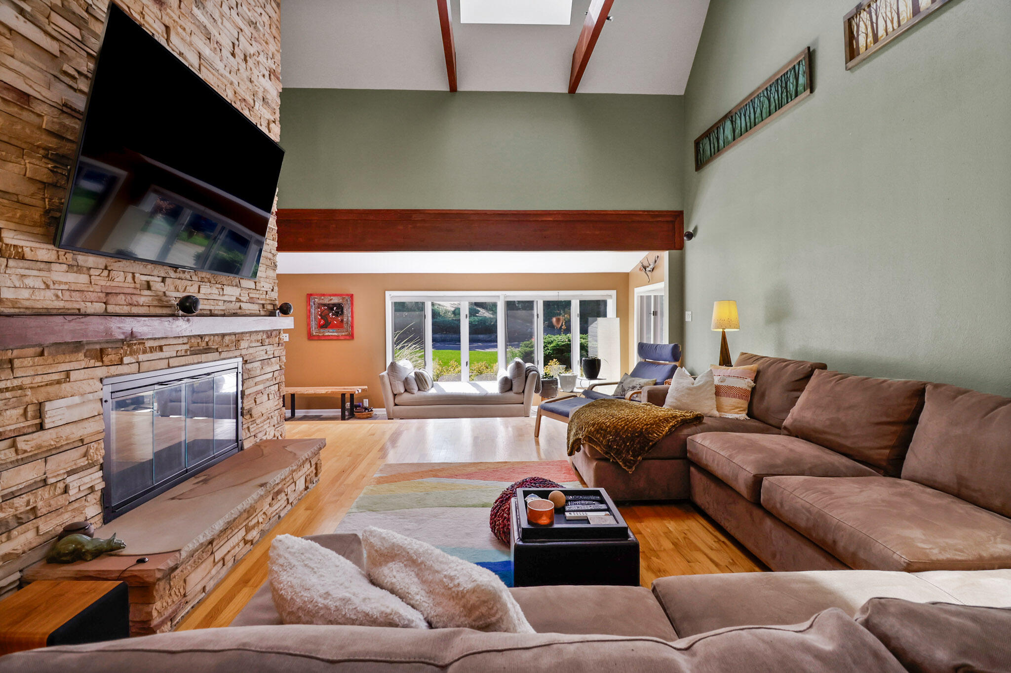 66 Ski Hill Road Portage, IN 46368 - Photo 6 of 48 a living room with furniture kitchen view and a fireplace