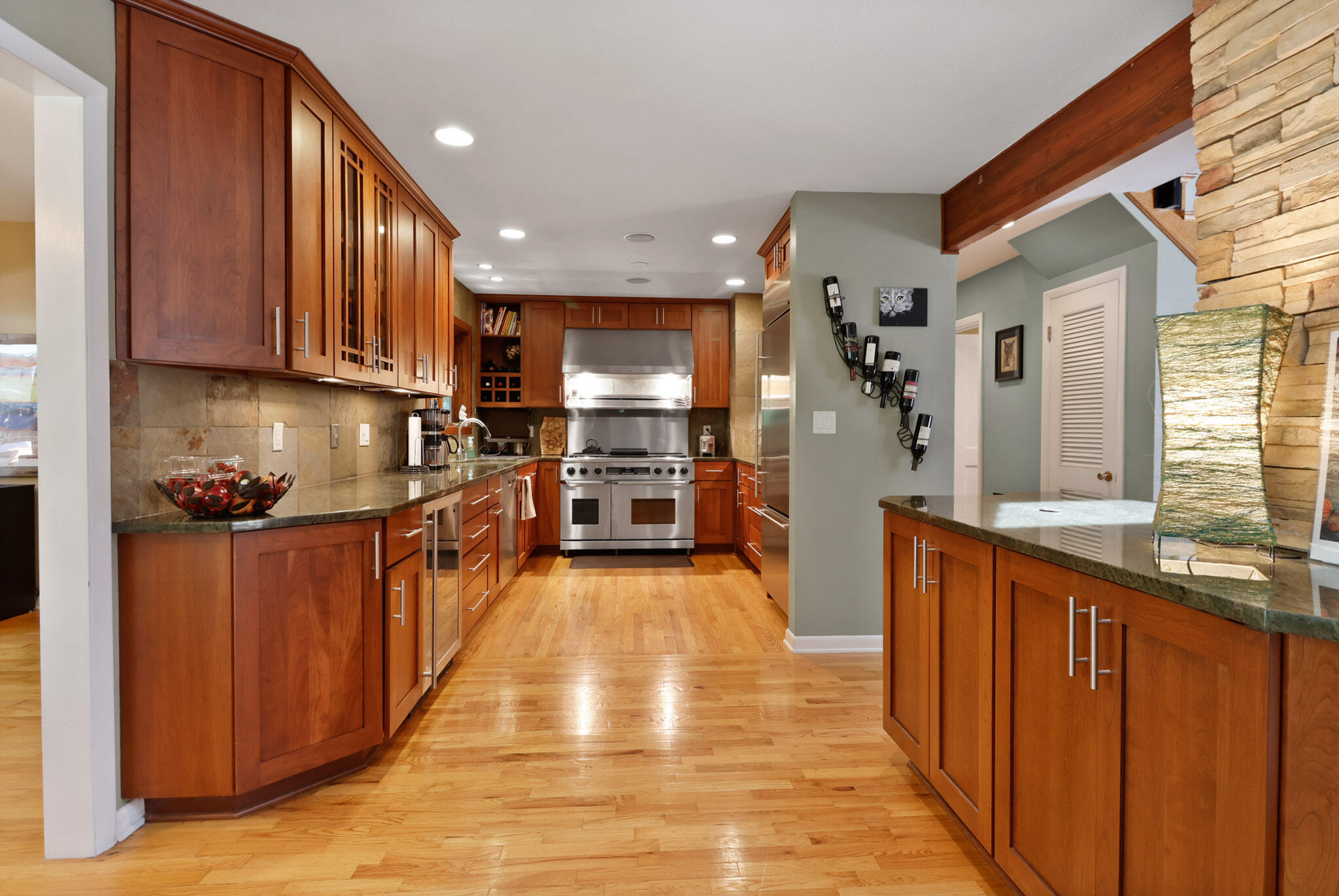 66 Ski Hill Road Portage, IN 46368 - Photo 8 of 48 a kitchen with stainless steel appliances granite countertop wooden cabinets a sink dishwasher a stove and a refrigerator