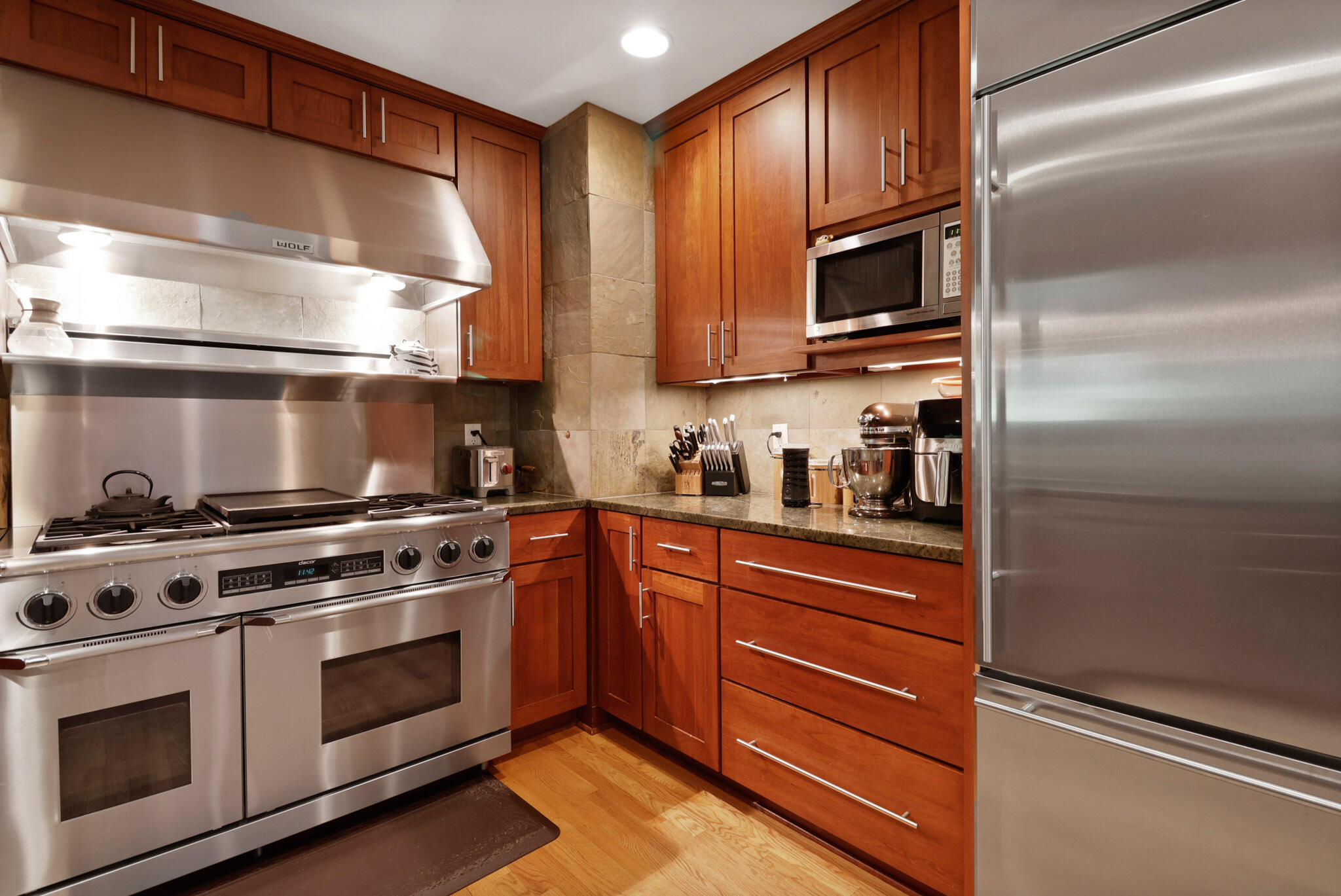 66 Ski Hill Road Portage, IN 46368 - Photo 9 of 48 a kitchen with stainless steel appliances granite countertop a stove and a refrigerator