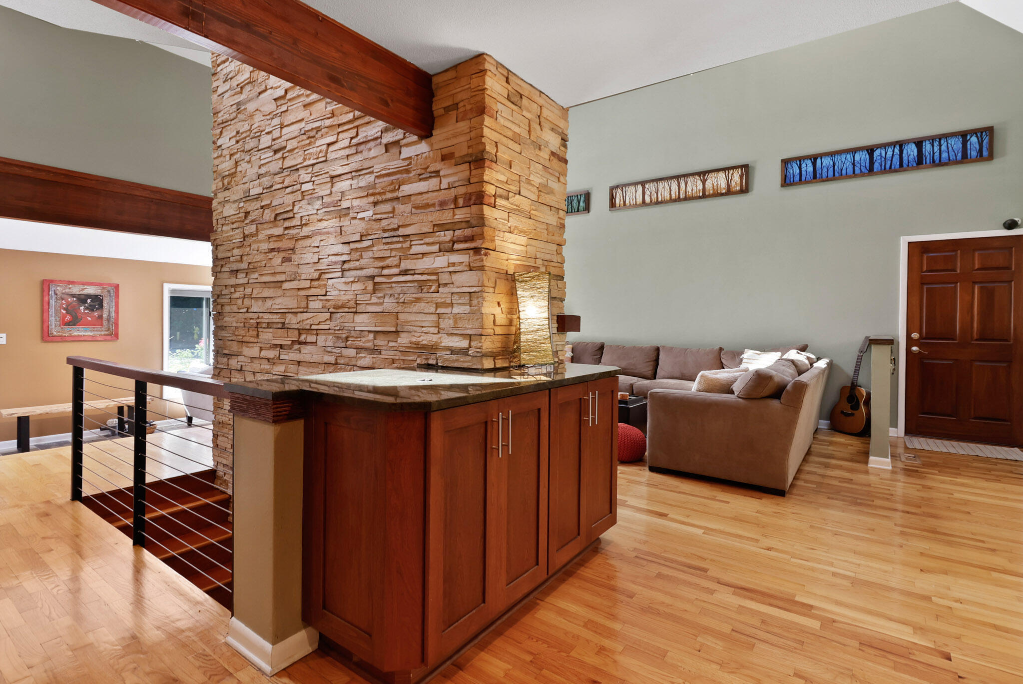 66 Ski Hill Road Portage, IN 46368 - Photo 10 of 48 a living room with furniture a wooden floor and a rug
