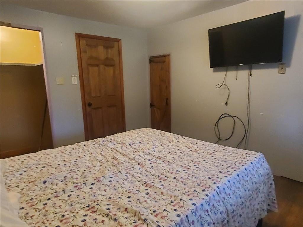 132 Laird's Crossing Road Worthington, PA 16262 - Photo 13 of 20 a bedroom with a bed and a flat screen tv