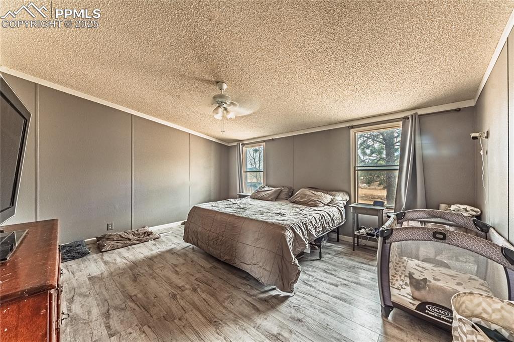 36 Valley Circle Guffey, CO 80820 - Photo 11 of 40 a bed room with a bed and a tv