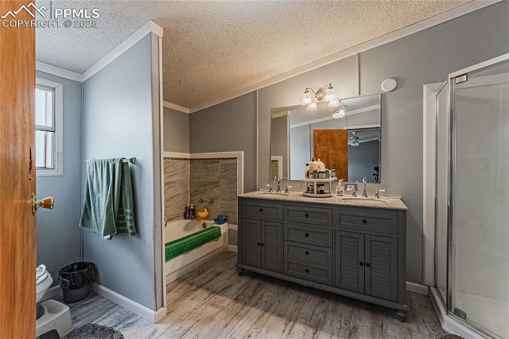 36 Valley Circle Guffey, CO 80820 - Photo 13 of 40 a bathroom with a sink double vanity and a mirror