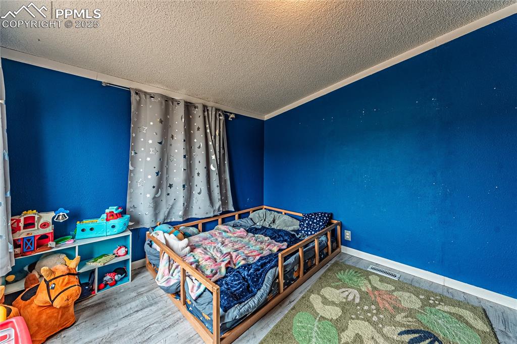 36 Valley Circle Guffey, CO 80820 - Photo 16 of 40 a bedroom with bed and a window