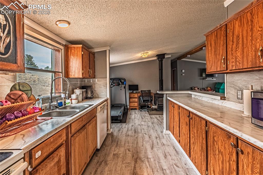 36 Valley Circle Guffey, CO 80820 - Photo 21 of 40 a kitchen with stainless steel appliances granite countertop a sink stove and cabinets