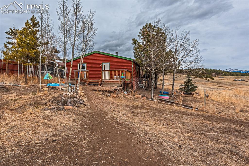36 Valley Circle Guffey, CO 80820 - Photo 28 of 40 a front view of a house with a yard