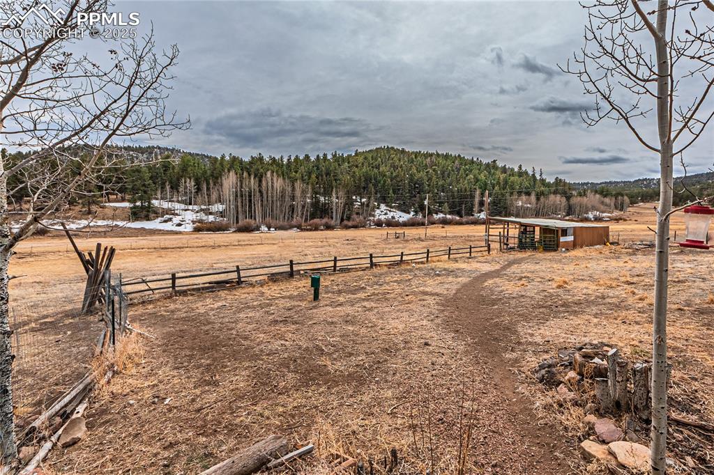 36 Valley Circle Guffey, CO 80820 - Photo 37 of 40 a backyard of a house with table and chairs