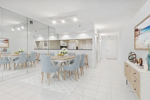 a large kitchen with a table and chairs
