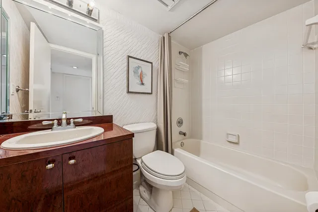 a bathroom with a sink a toilet and a bathtub