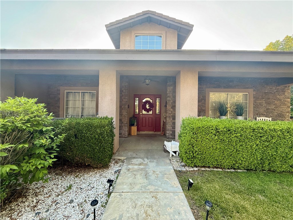 9869 Kehl Canyon Road Cherry Valley, CA 92223 - Photo 16 of 27 front view of a house with a yard
