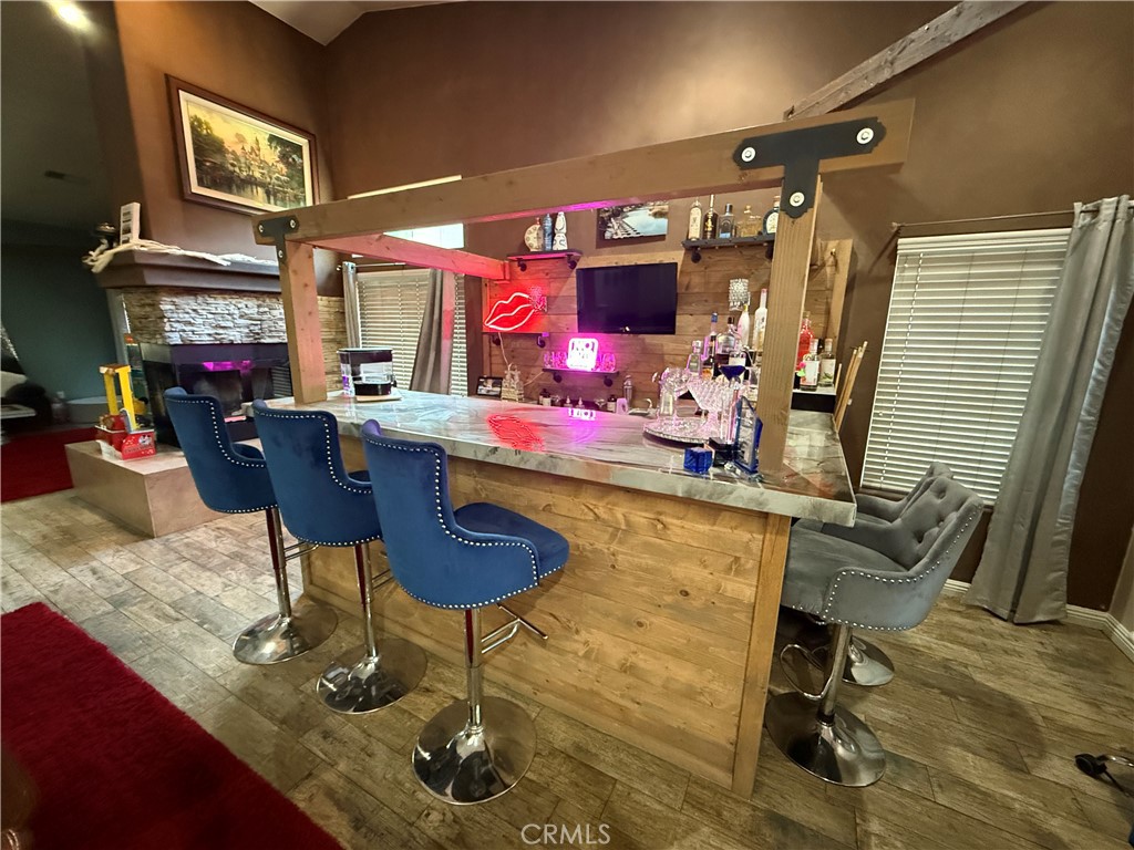 9869 Kehl Canyon Road Cherry Valley, CA 92223 - Photo 27 of 27 a view of a dining room with furniture and a chandelier