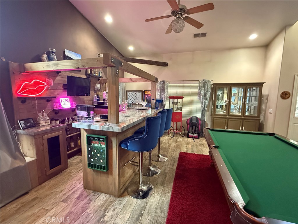 9869 Kehl Canyon Road Cherry Valley, CA 92223 - Photo 5 of 27 a living room with furniture and a wooden floor