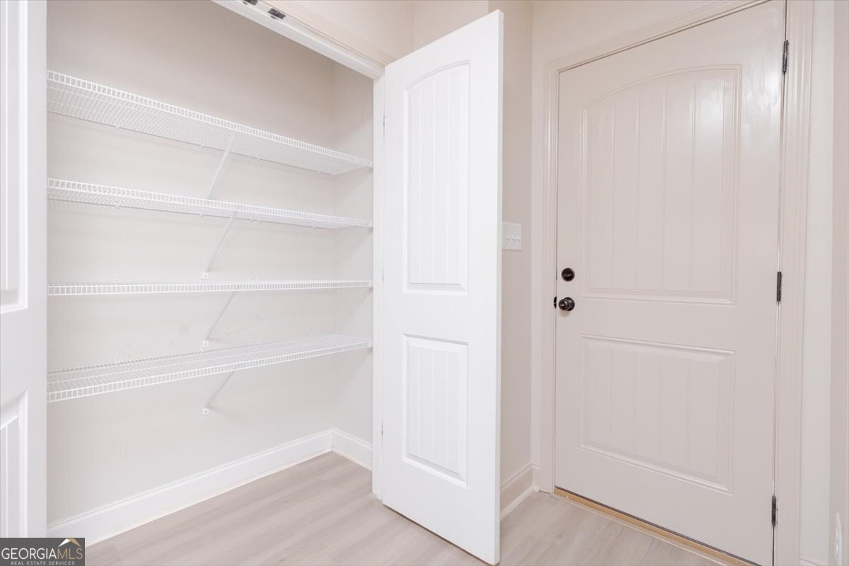 104 Gunner Lane Perry, GA 31069 - Photo 23 of 48 a view of an empty walk in closet