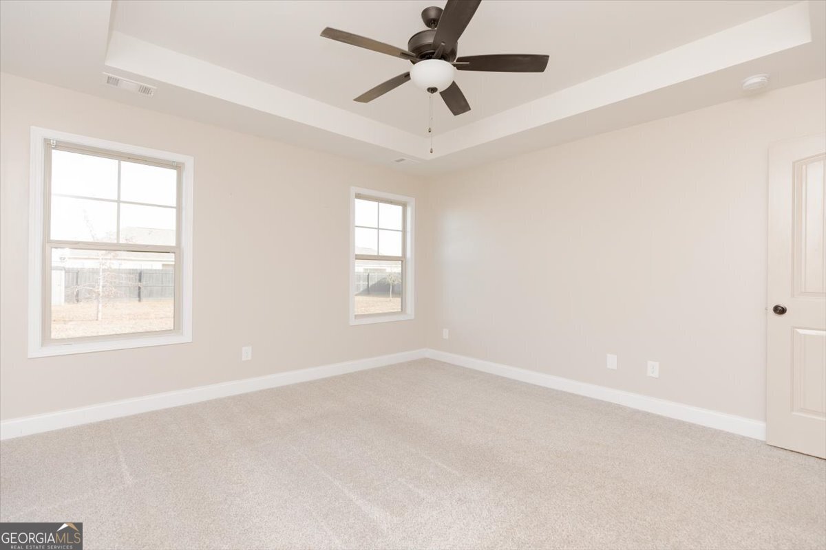 104 Gunner Lane Perry, GA 31069 - Photo 26 of 48 an empty room with a window and a fan