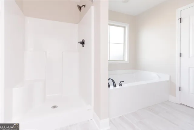 a white bath tub sitting next to a window