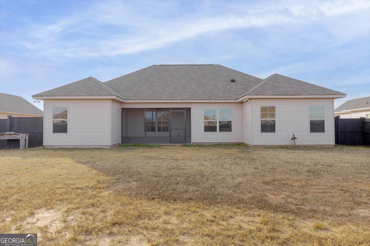 104 Gunner Lane Perry, GA 31069 - Photo 44 of 48 a backyard of a house with large trees