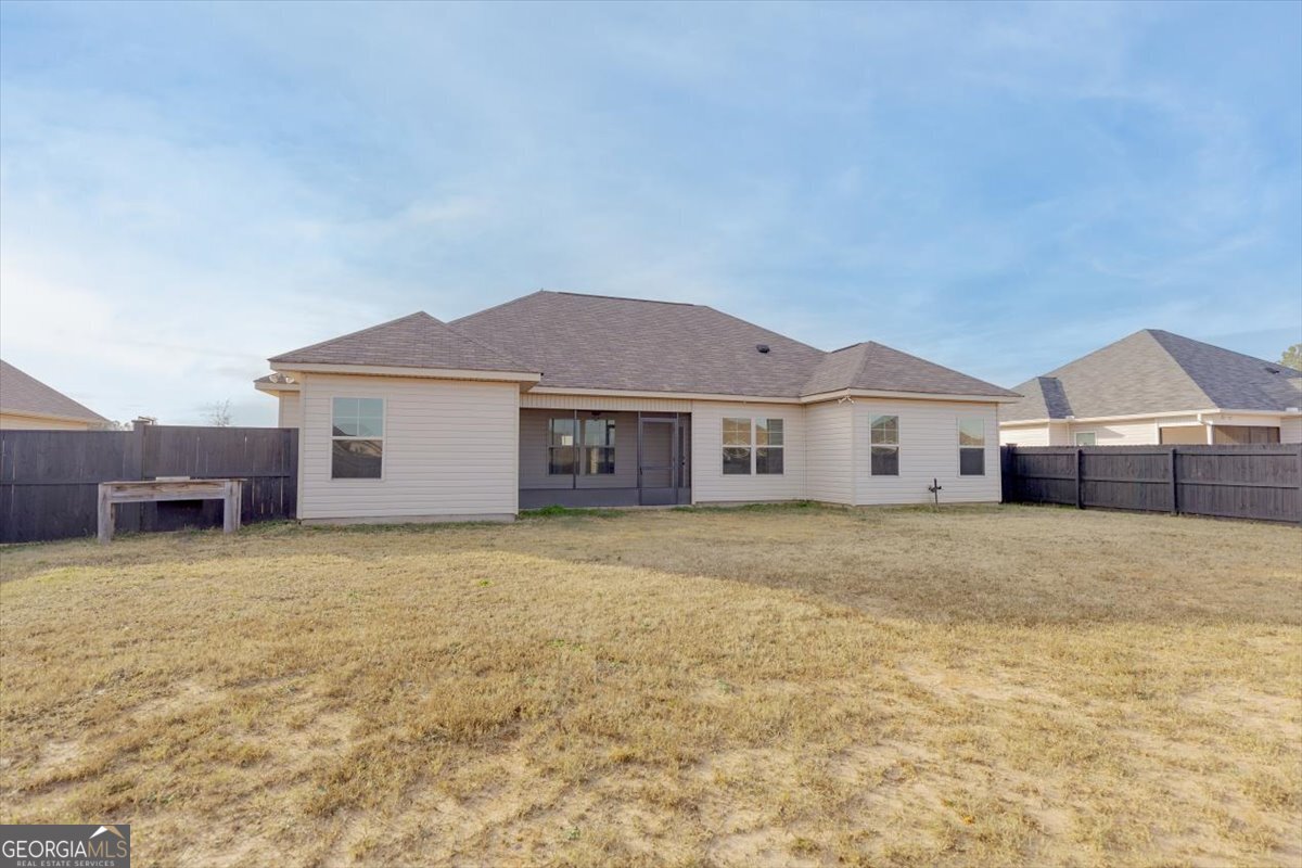 104 Gunner Lane Perry, GA 31069 - Photo 45 of 48 a view of a yard in front of a house with a large tree