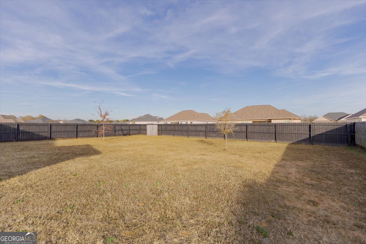 104 Gunner Lane Perry, GA 31069 - Photo 48 of 48 a view of a lake and a yard