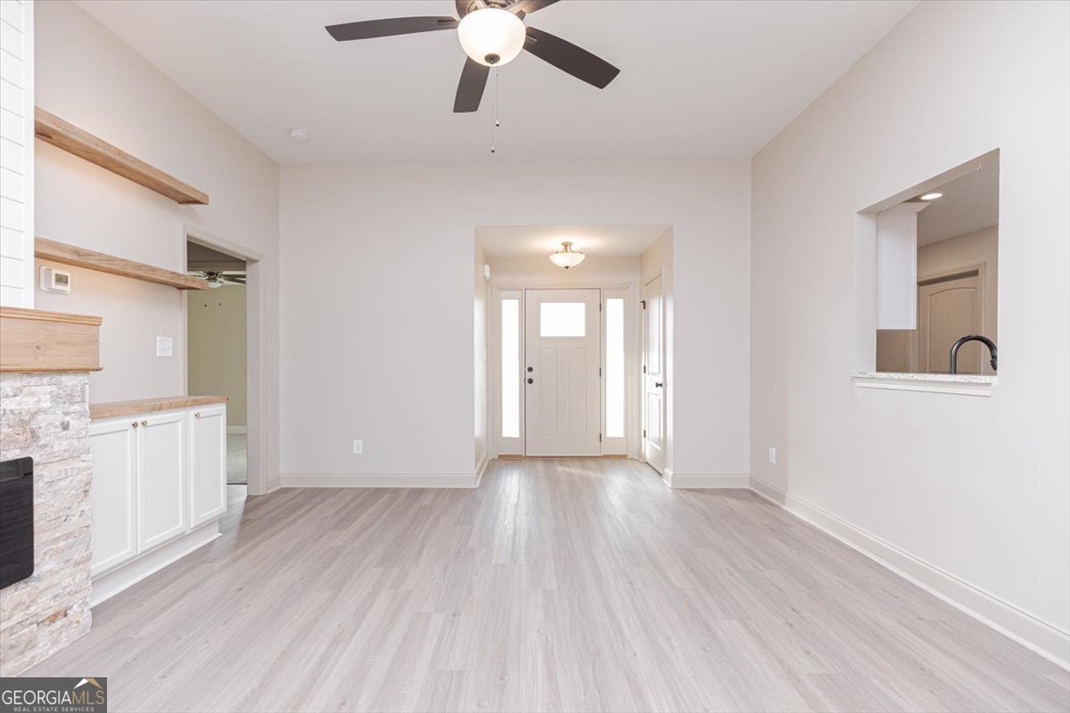 104 Gunner Lane Perry, GA 31069 - Photo 10 of 48 a view of a kitchen with a sink dishwasher and wooden floor