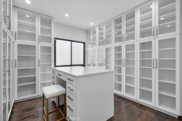 a kitchen with a refrigerator and a stove