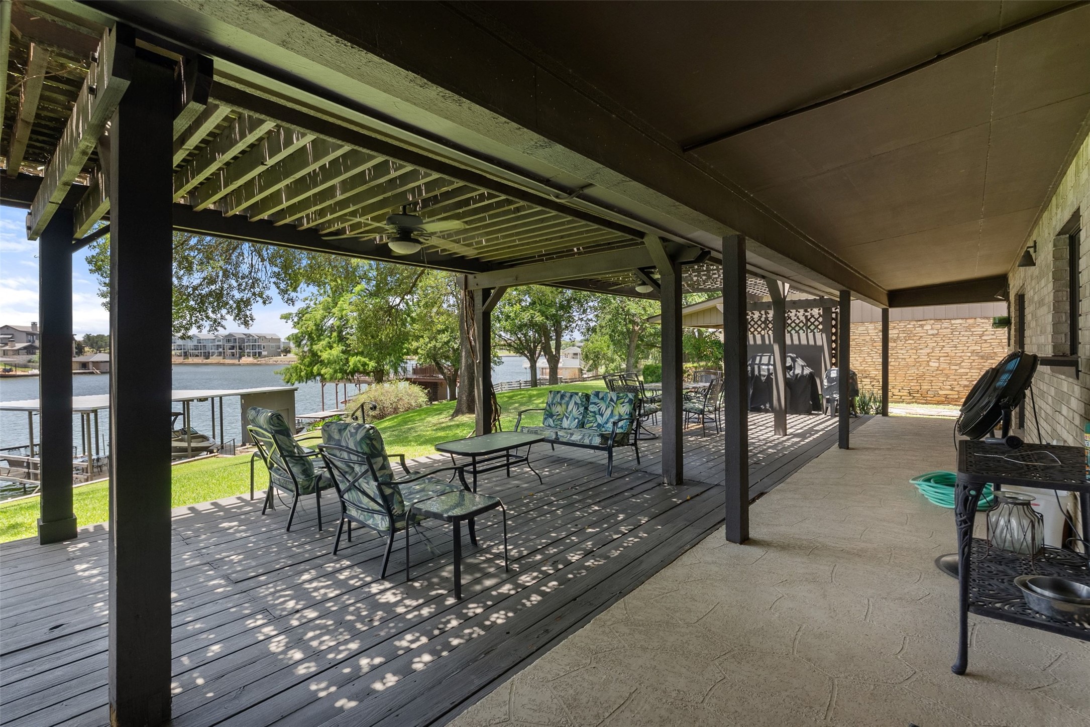 141 Perry Lane Kingsland, TX 78639 - Photo 24 of 40 An inviting covered patio offers ample space for entertaining and picturesque lake views.