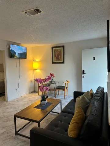 a living room with furniture and a table
