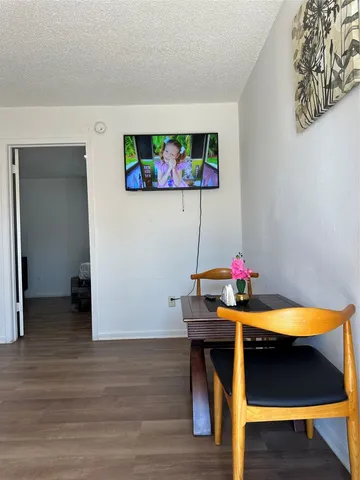 a room with furniture and wooden floor