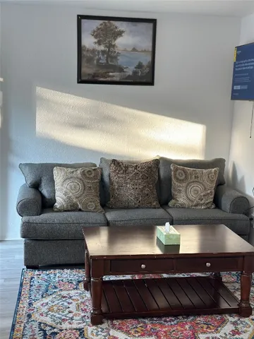 a living room with furniture and a couch