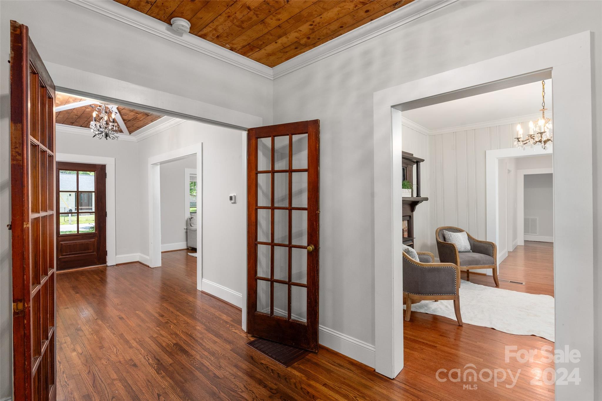 110 Park Road West Indian Trail, NC 28079 - Photo 13 of 41 a view of a hallway with wooden floor and dining room
