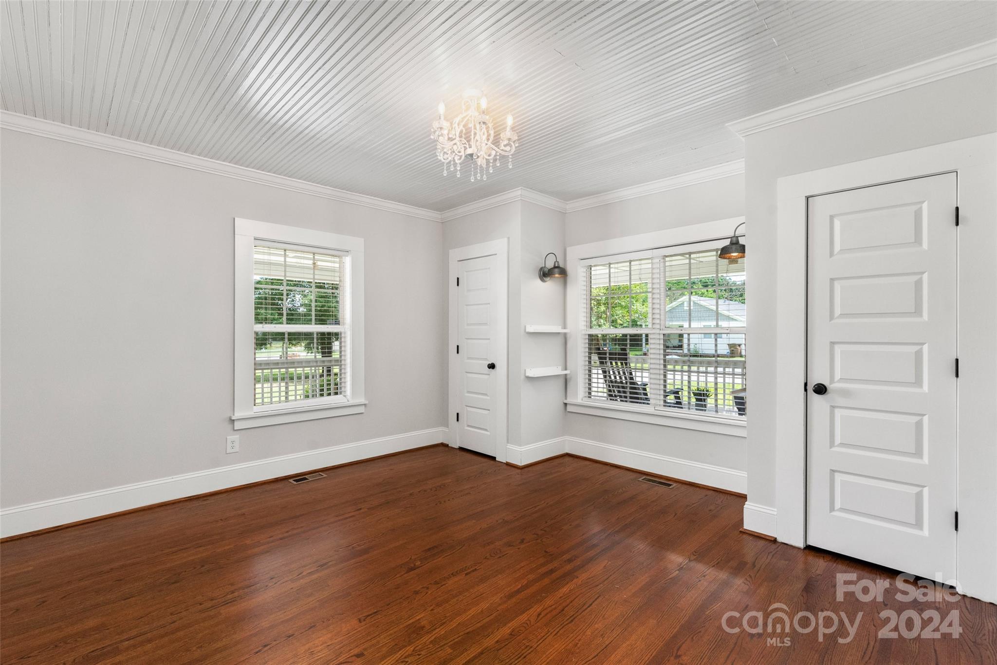 110 Park Road West Indian Trail, NC 28079 - Photo 14 of 41 an empty room with wooden floor and windows