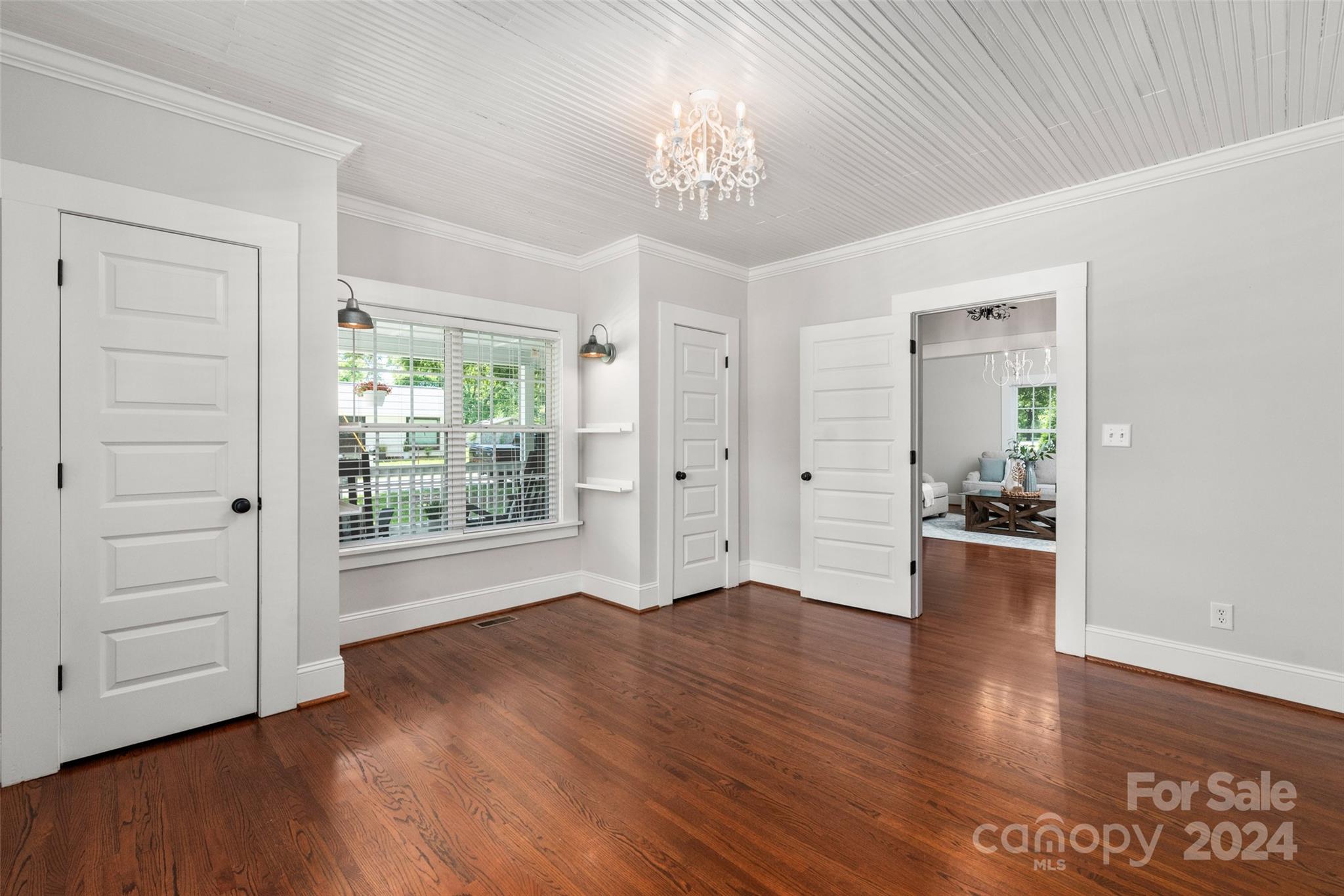 110 Park Road West Indian Trail, NC 28079 - Photo 15 of 41 a view of a big room with wooden floor and windows