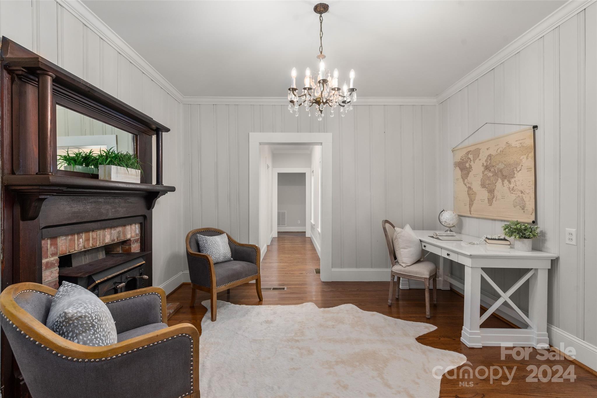 110 Park Road West Indian Trail, NC 28079 - Photo 16 of 41 a living room with furniture a fireplace and a flat screen tv