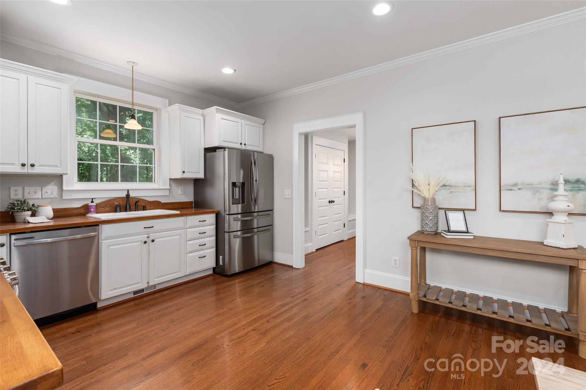 110 Park Road West Indian Trail, NC 28079 - Photo 22 of 41 a kitchen with stainless steel appliances a refrigerator and wooden cabinets