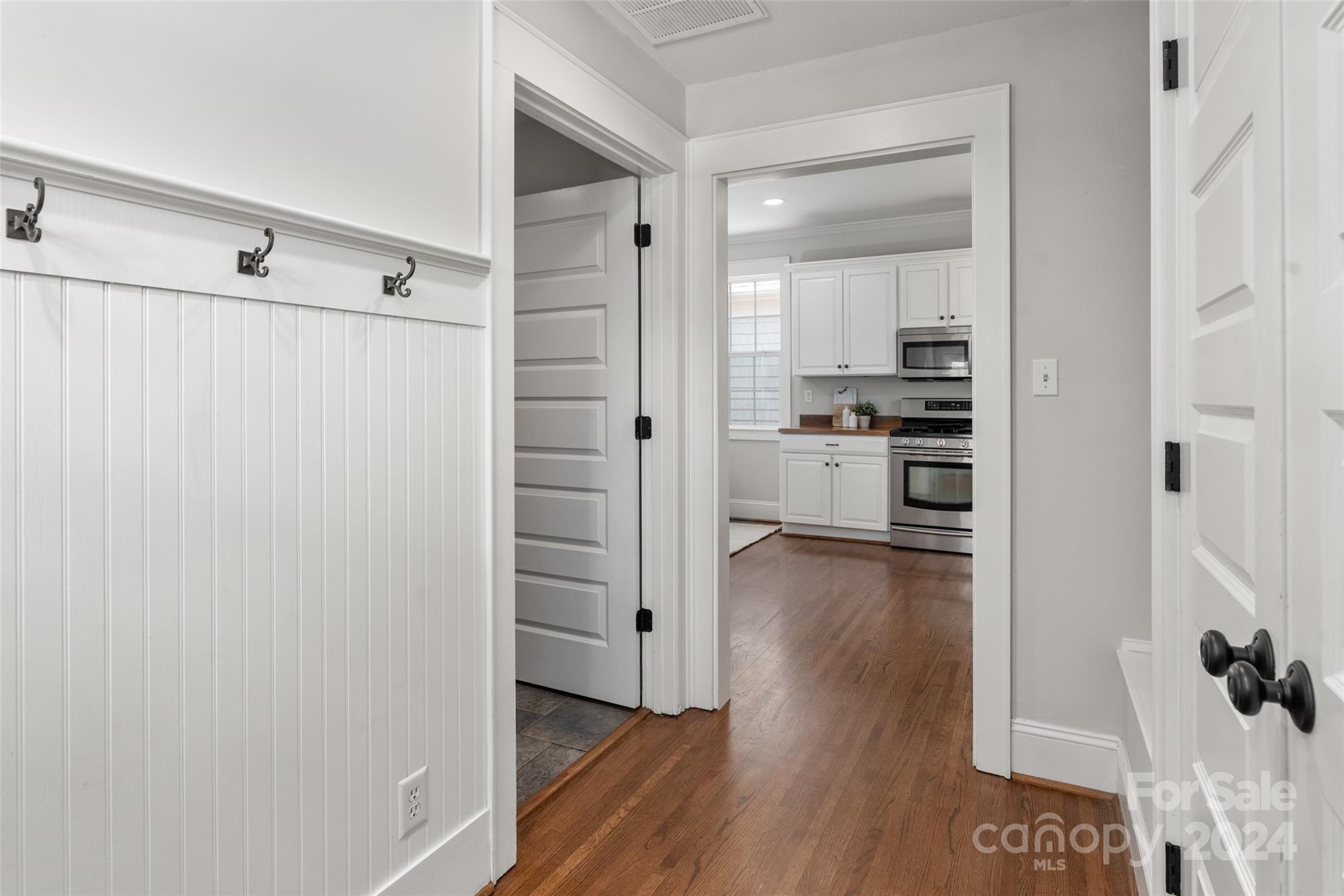110 Park Road West Indian Trail, NC 28079 - Photo 28 of 41 a view of a kitchen with a white cabinet and a stove top oven
