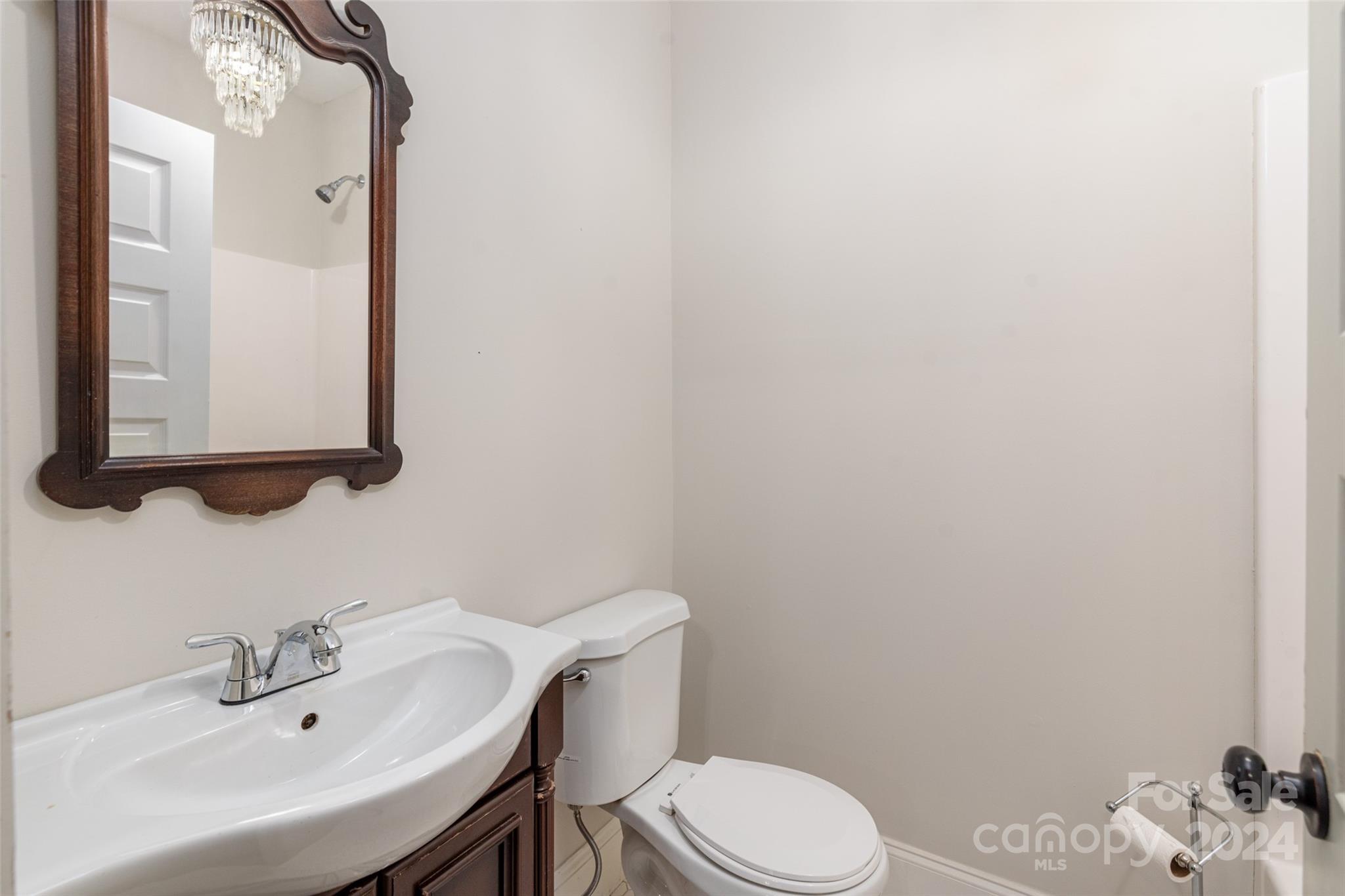 110 Park Road West Indian Trail, NC 28079 - Photo 29 of 41 a bathroom with a sink a toilet and mirror