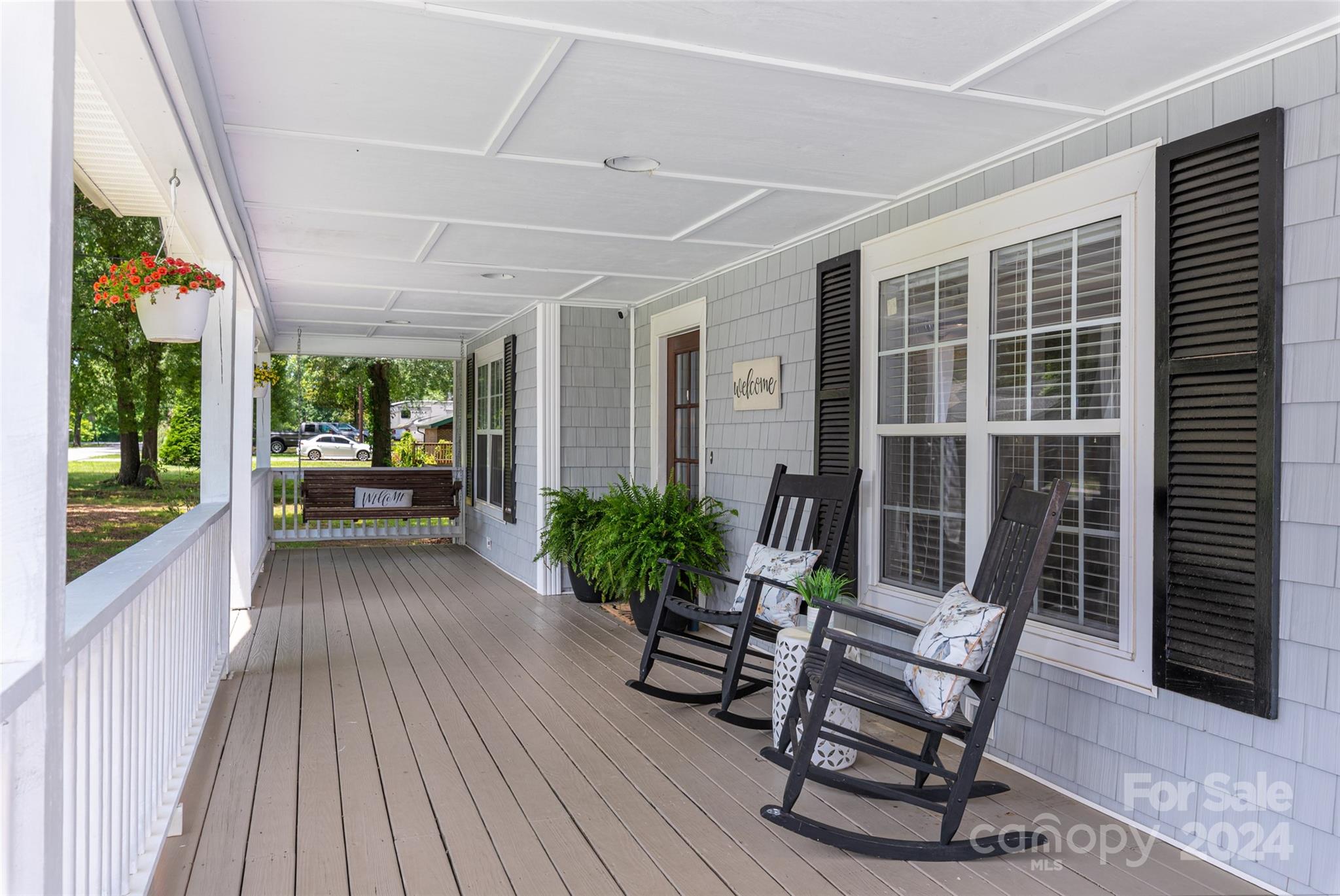110 Park Road West Indian Trail, NC 28079 - Photo 3 of 41 a view of a patio with table and chairs and potted plants