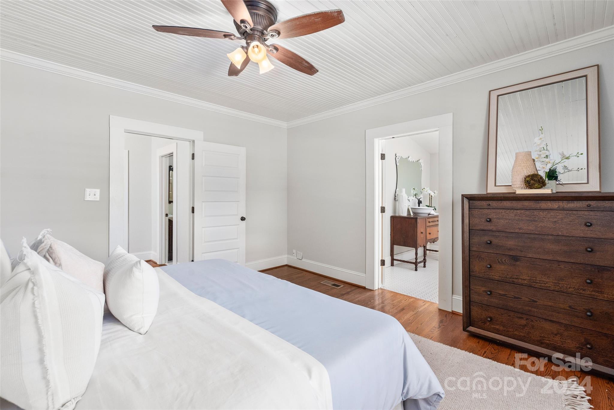 110 Park Road West Indian Trail, NC 28079 - Photo 32 of 41 a bedroom with a bed and a chandelier