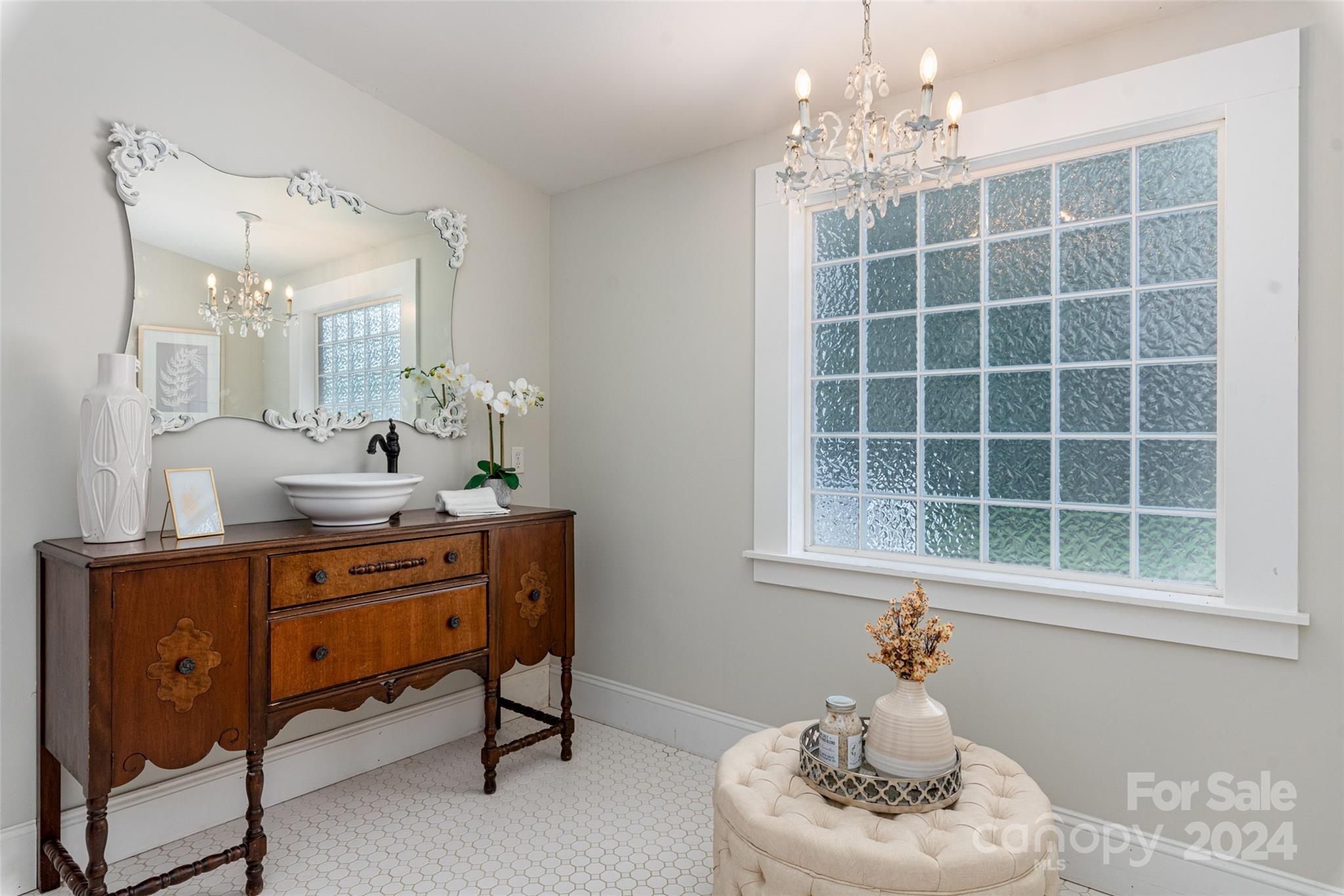 110 Park Road West Indian Trail, NC 28079 - Photo 33 of 41 a living room with furniture and a chandelier