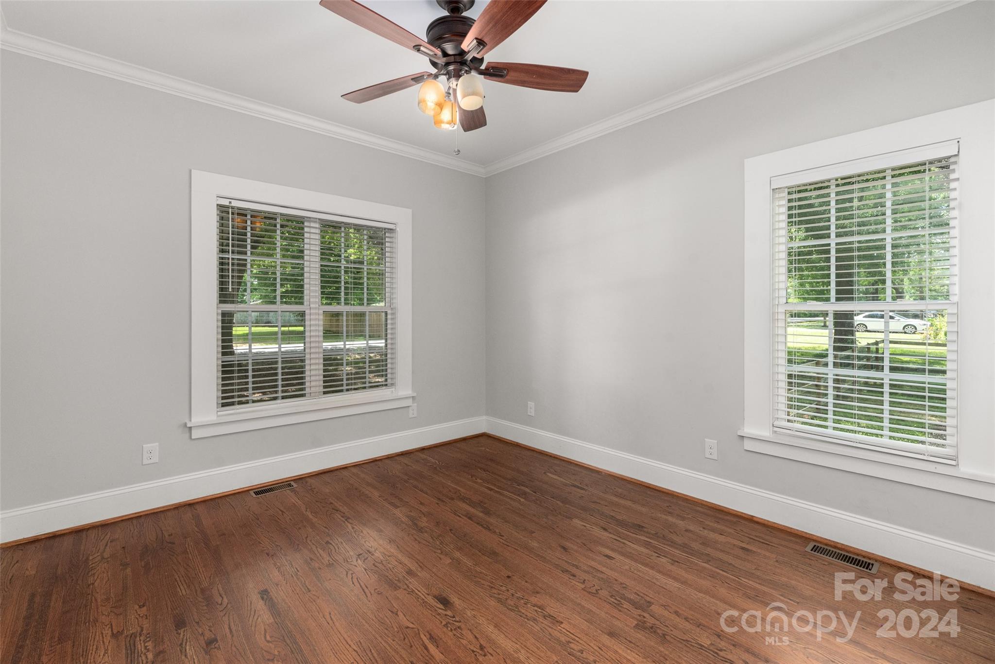 110 Park Road West Indian Trail, NC 28079 - Photo 34 of 41 a view of an empty room with wooden floor and a window