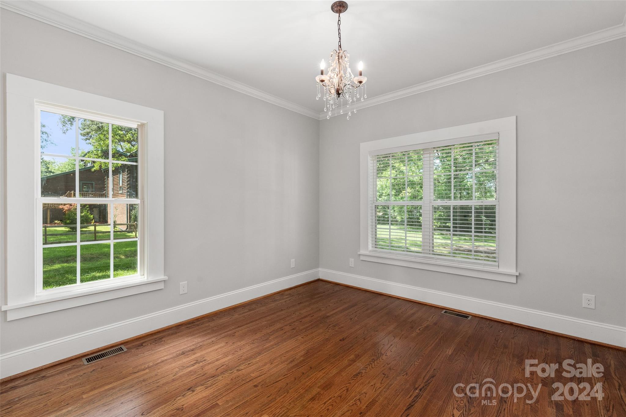 110 Park Road West Indian Trail, NC 28079 - Photo 36 of 41 a view of an empty room with wooden floor and a window