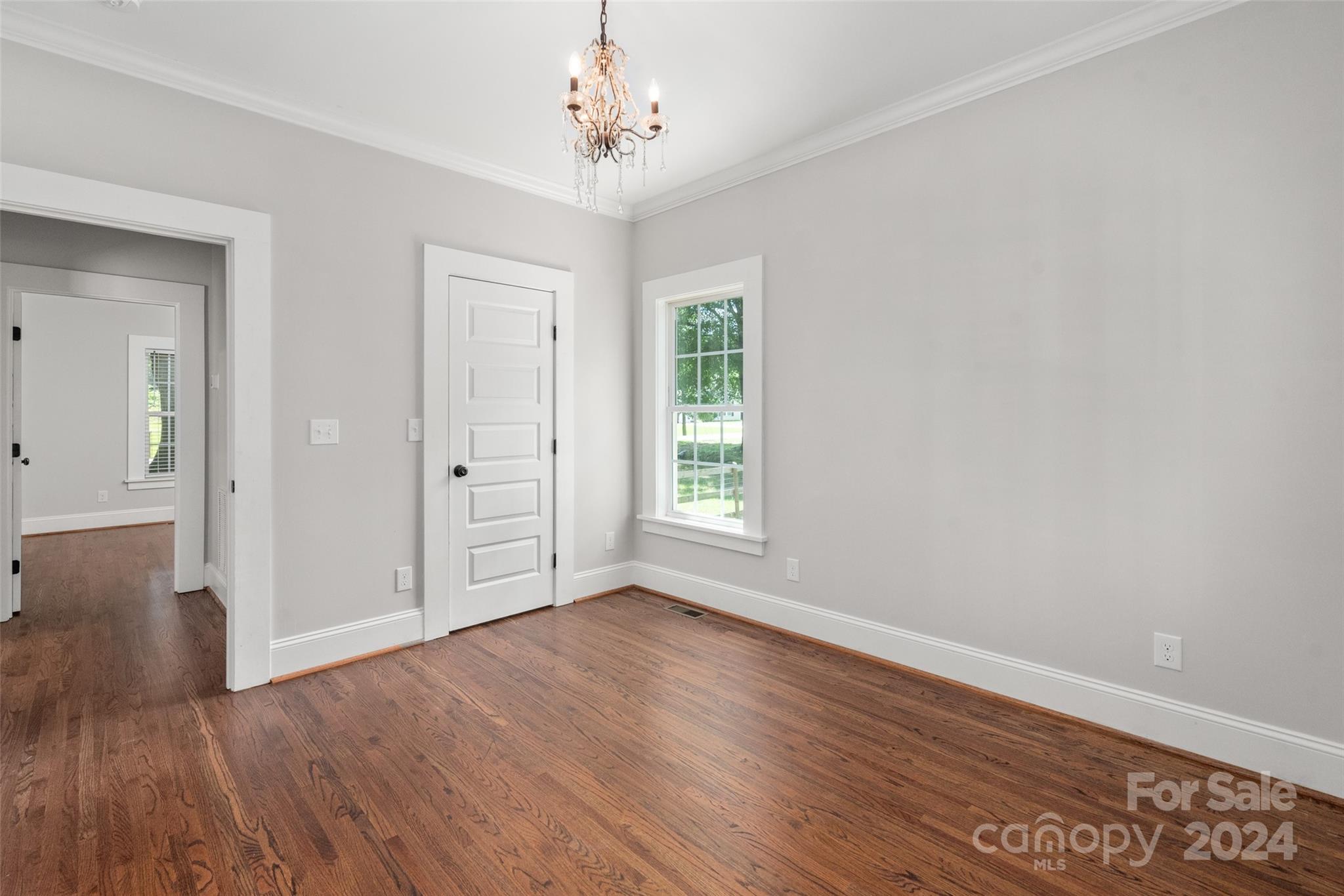 110 Park Road West Indian Trail, NC 28079 - Photo 37 of 41 a view of empty room with wooden floor and fan