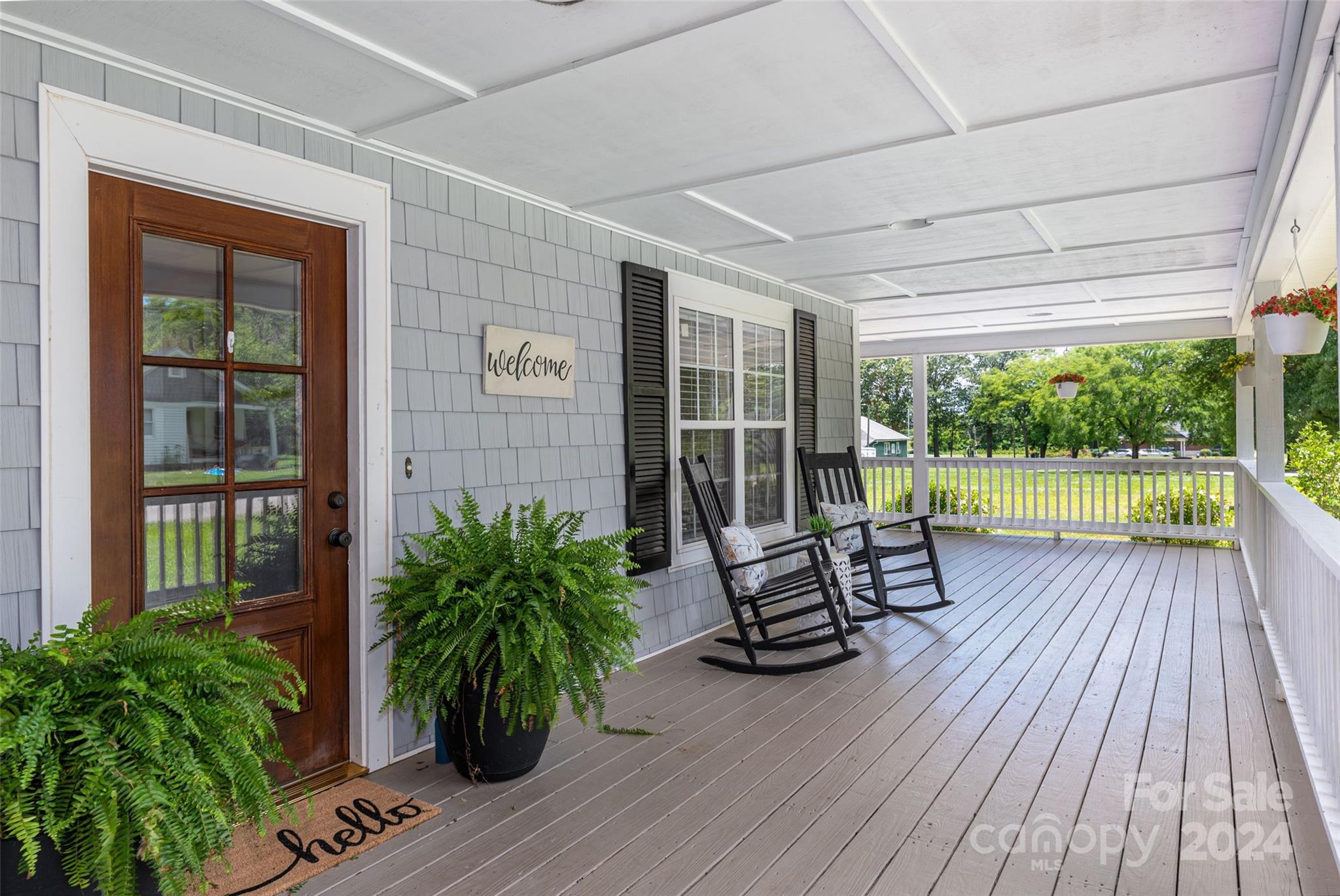 110 Park Road West Indian Trail, NC 28079 - Photo 5 of 41 a house with porch and wooden floor
