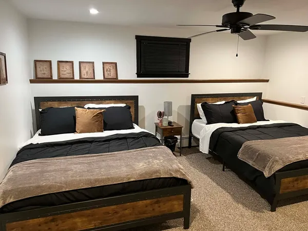 a bedroom with bed and a tv