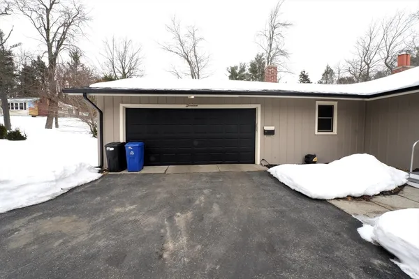 a front view of a house with garage